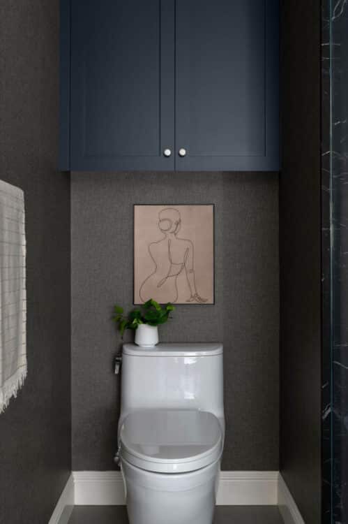 Lady Line Art Over Toilet In Bathroom